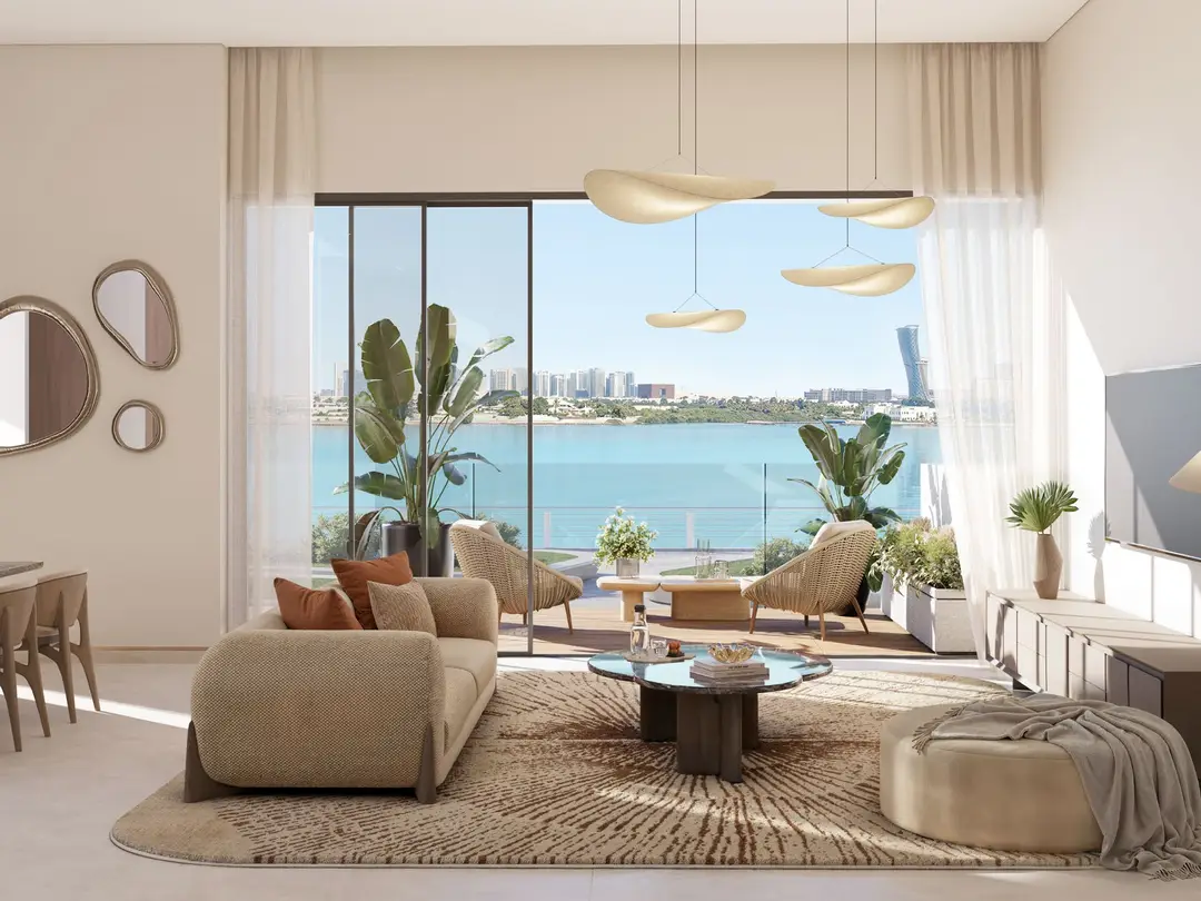 Bashayer 2 bedroom townhome living room opening to a sea-view terrace